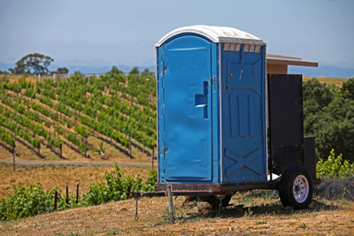 portable toilet trailer at a wine vineyard